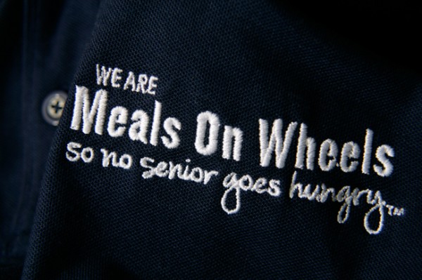 Meals On Wheels logo embroidered in white