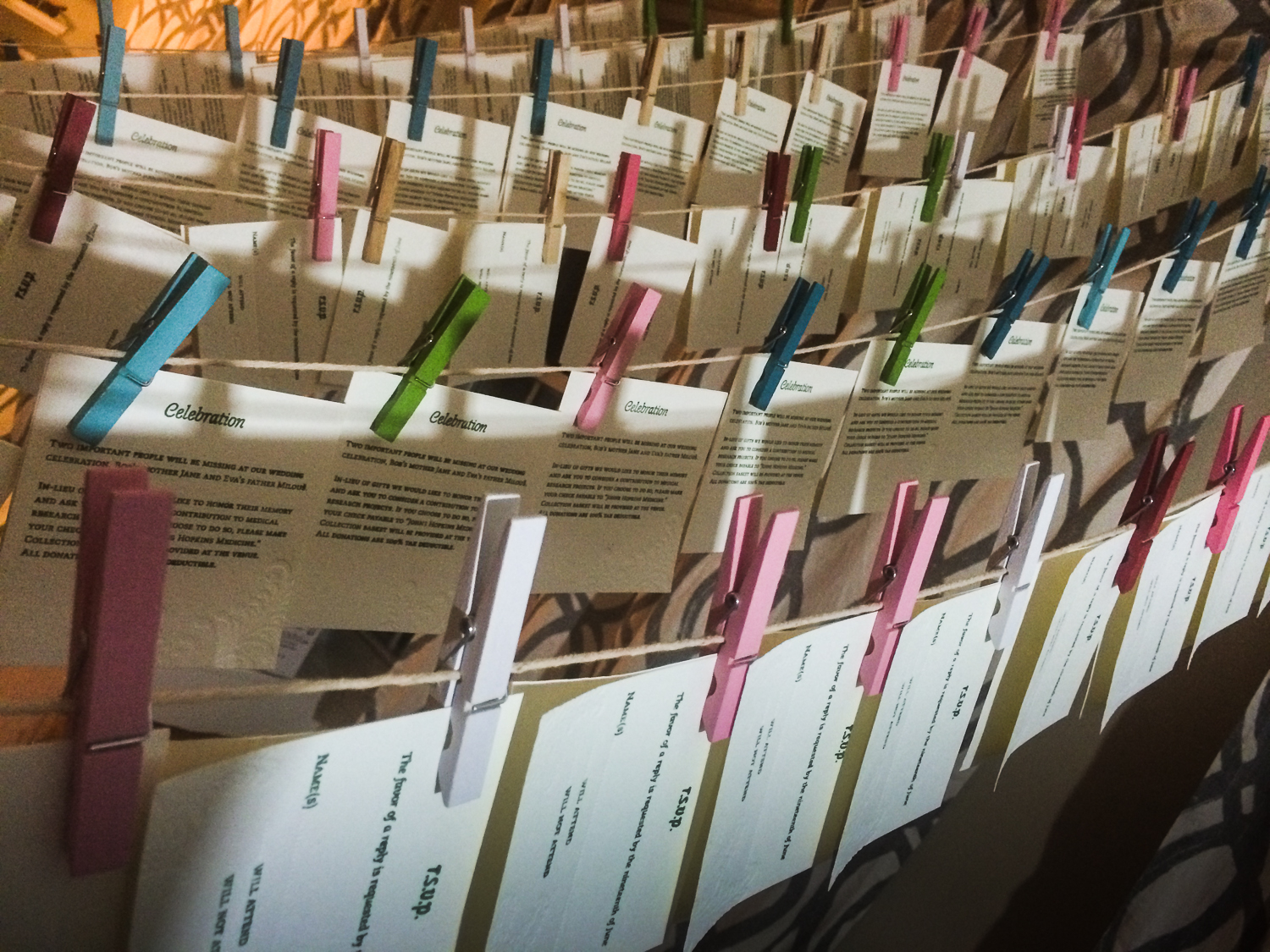 Letterpress invitations on drying rack.